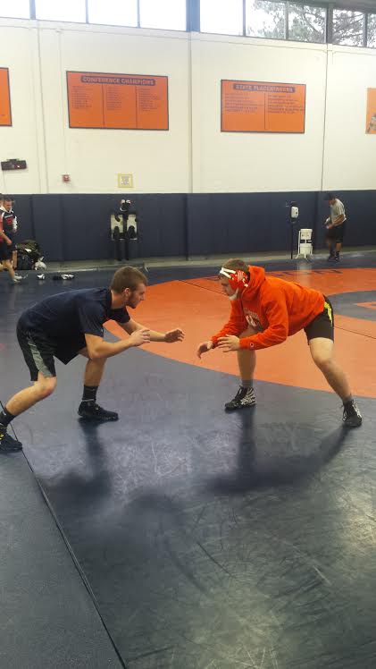 Varsity wrestlers Devin Curran and Alex Horvat practice their technique at a recent practice.